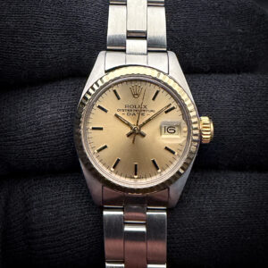 1978 Rolex Oyster Perpetual Date Ref. 6917 in a 26mm stainless steel case, with gold fluted bezel, powered by the Rolex caliber 2030 automatic movement. This Rolex has been tested in good working order and is ready for daily wear. Case Serial Number: 5444XXX