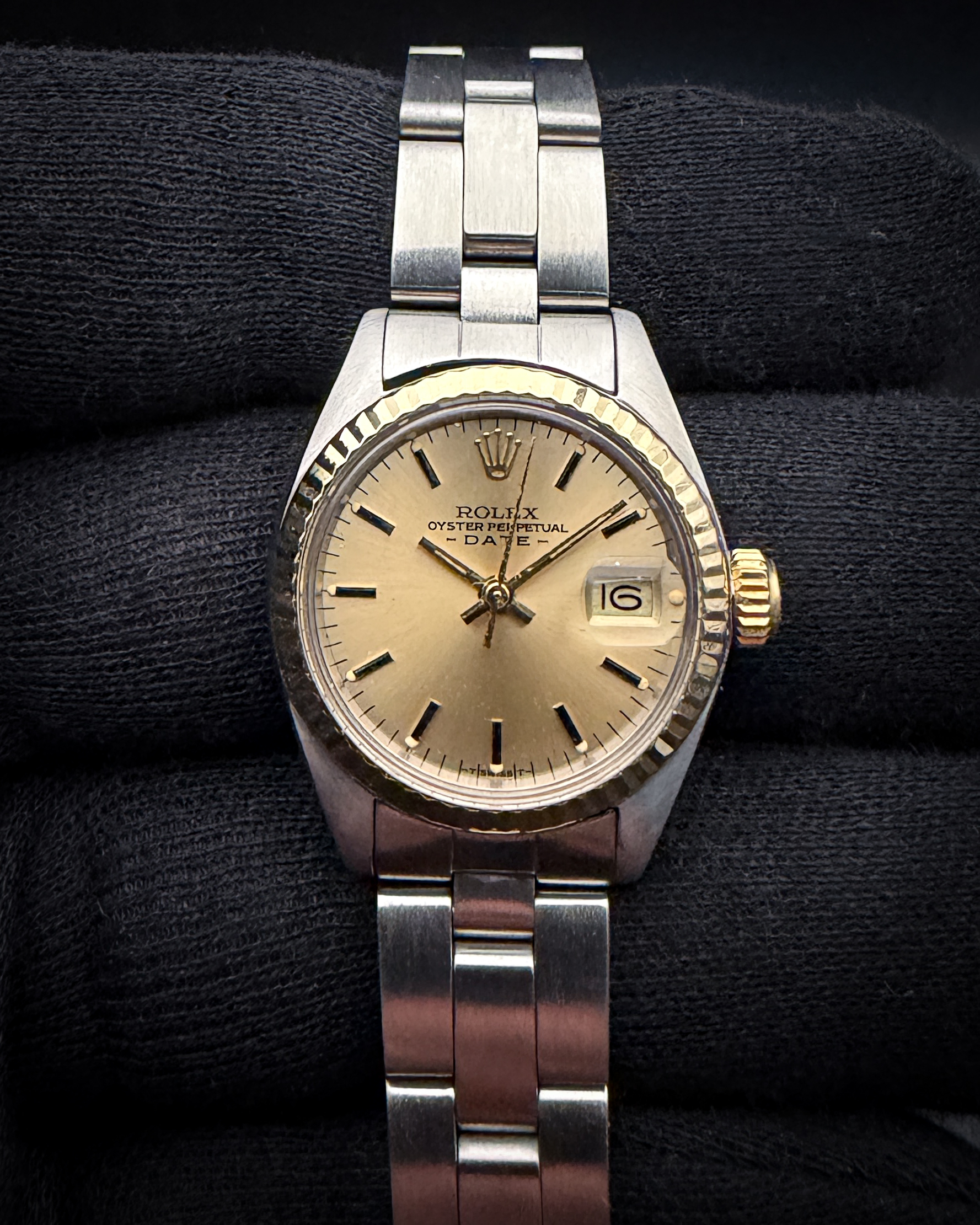 1978 Rolex Oyster Perpetual Date Ref. 6917 in a 26mm stainless steel case, with gold fluted bezel, powered by the Rolex caliber 2030 automatic movement. This Rolex has been tested in good working order and is ready for daily wear. Case Serial Number: 5444XXX