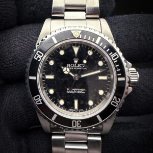 1996 (T-Serial) Rolex 14060 Submariner "No-Date" in a 40mm stainless steel case, powered by the Rolex caliber 3000 automatic movement. This Submariner was serviced August, 2026. It has been tested in excellent working order and is ready for wear or to be added to a collection. Includes a new Wrist Wraith Travel roll and a TLC Warranty/Authentication Card. Case Serial Number: T226993 Accuracy Testing: -+/-4SPD / 264 Amplitude / .2ms Beat Error