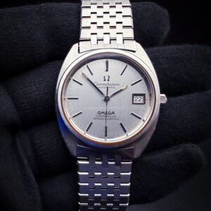 1973 Omega Constellation Date ST168.0056 in a 35 x 40mm tonneau-shape stainless steel case, powered by the Omega caliber 1011 automatic movement. This Omega has been tested in good working order and is ready for wear or to be added to a collection. Includes a new Wrist Wraith Travel roll and a TLC Authentication and Warranty Card. Serial Number: 36140133