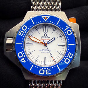 Omega PloProf 1200m Titanium 227.90.55.21.04.001 with the coveted white dial and blue ceramic bezel. This PloProf has been tested in excellent working order and is ready for daily wear or to be added to a collection. Includes: Outer box; inner case; blue strap; long and short titanium shark-mesh straps; instructions booklet; Pictogram card; Master Chronometer card; and International Warranty Card. Serial Number: 87713XXX