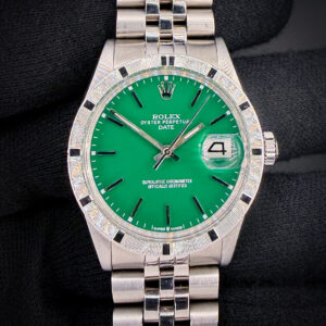 c. 1972 Rolex Oyster Perpetual Date 1501 in a 34mm stainless steel case, featuring a custom green dial, powered by the Rolex 1570 automatic movement. This Rolex has been tested in wonderful working order and is ready for daily wear. Includes the outer box; inner case; booklet, leatherette wallet; and TLC authentication card: Case Serial Number: 31493XX