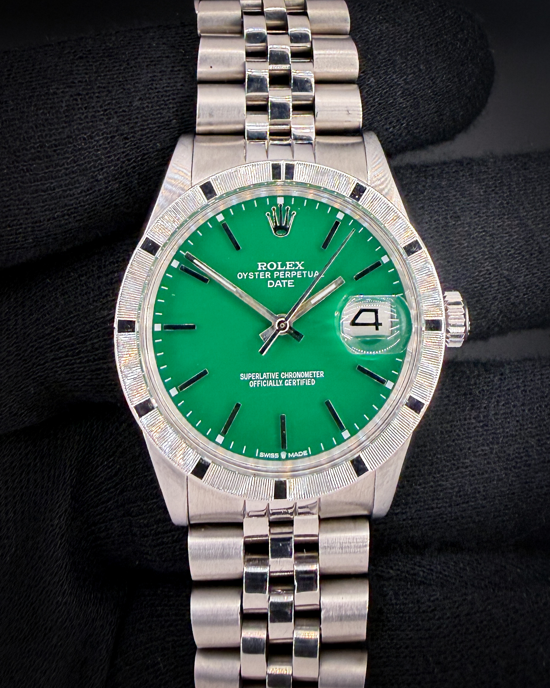 c. 1972 Rolex Oyster Perpetual Date 1501 in a 34mm stainless steel case, featuring a custom green dial, powered by the Rolex 1570 automatic movement. This Rolex has been tested in wonderful working order and is ready for daily wear. Includes the outer box; inner case; booklet, leatherette wallet; and TLC authentication card: Case Serial Number: 31493XX