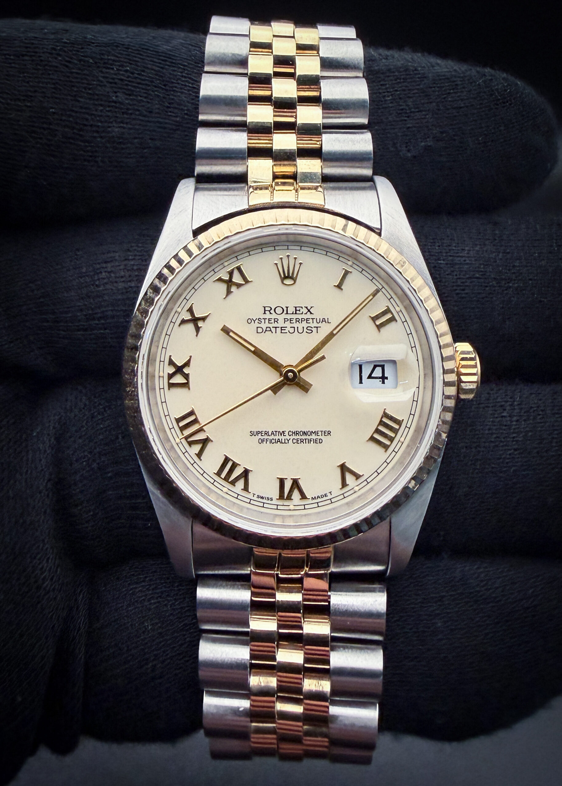1991 (X-Serial) Rolex 16220 in a 36mm stainless steel and yellow gold case, featuring the rare cream roman numeral dial, and powered by the Rolex 3135 automatic movement. This Rolex was serviced in September 2026 and is ready for wear or to be added to a collection. Accuracy Testing: +/-5 SPD / 285 Amplitude / .2ms Beat Error Case Serial Number: X209XXX