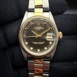 1969 Rolex Oyster Perpetual Date 1505 in a 34mm yellow gold and stainless steel case, featuring the brown "Door Stop" dial, powered by the Rolex 1570 automatic movement. This Roles has been tested in excellent working order and is ready for daily wear. Case Serial Number: 22719XX