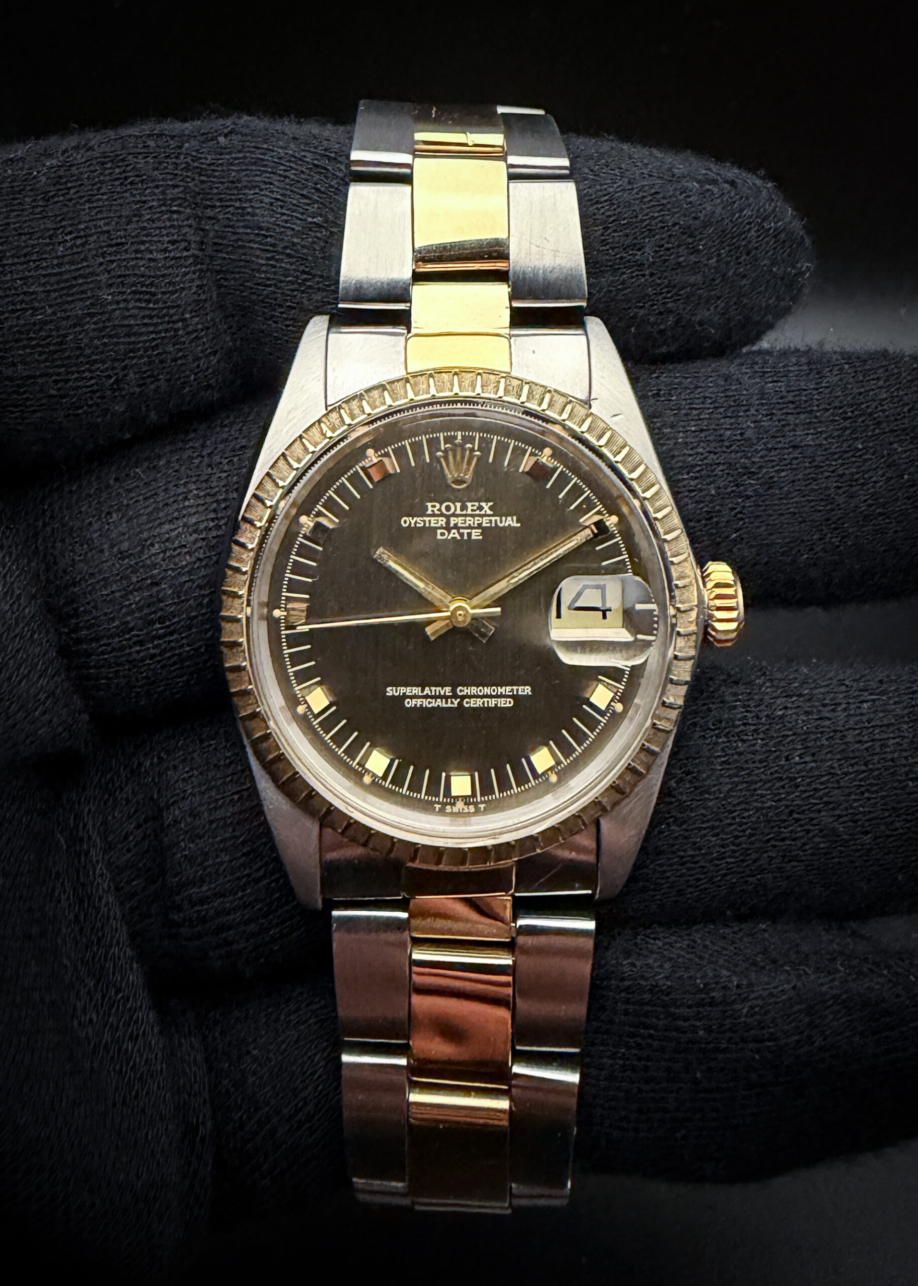1969 Rolex Oyster Perpetual Date 1505 in a 34mm yellow gold and stainless steel case, featuring the brown "Door Stop" dial, powered by the Rolex 1570 automatic movement. This Roles has been tested in excellent working order and is ready for daily wear. Case Serial Number: 22719XX