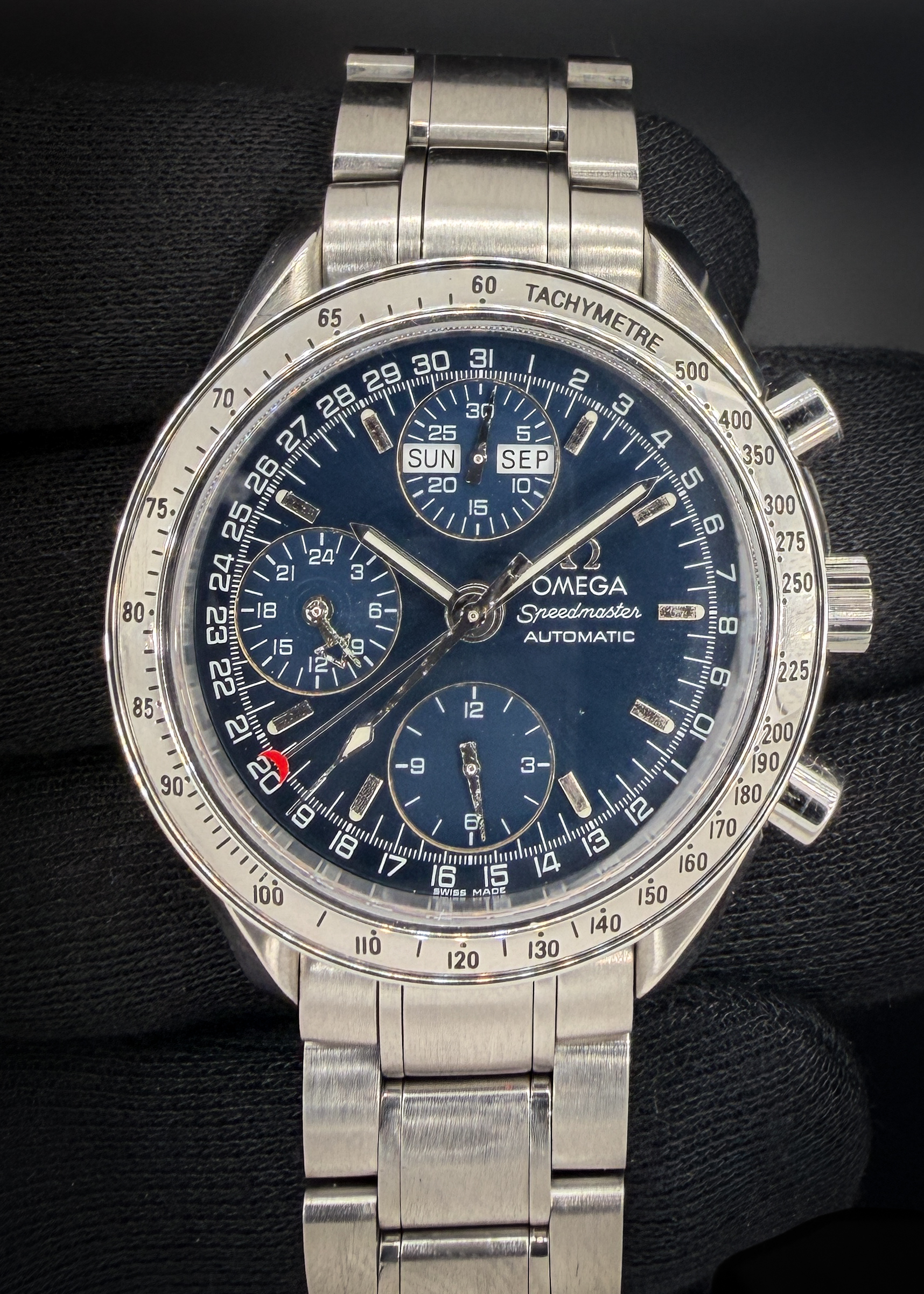 Vintage 1998 Omega Speedmaster Day-Date Triple Calendar 3523.80.00 in a 39mm stainless steel case, featuring the Omega caliber 1151 automatic movement. This Speedmater has been tested in good working order, with all functions operating as designed. Includes Omega Service Case and TLC Warranty/Authentication card. Accuracy Testing: +3 SPD / 287 Amp / 0.0ms Beat Error Caseback Serial Number: 59005270