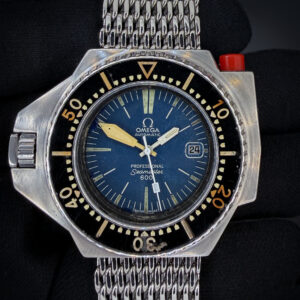 The original Omega Seamaster PloProf 166.077. This PloProf was fully serviced by Omega-Authorized TM Watch Company in September 2026 and is ready for daily wear or to be added to a collection: Includes full service documentation; travel case; and our TLC Warrant & Authentication Card. This watch is stunning in every way. The crystal is clean with no scratches or mars. The original dial is beautiful with a light patina and fading. The original hands show a matching patina and fading with the dial. The original bakelite bezel is gorgeous with light marks consistent with 50 years of age. The case is in wonderful vintage condition with light marks consistent with age, but no significant scratches or dents.