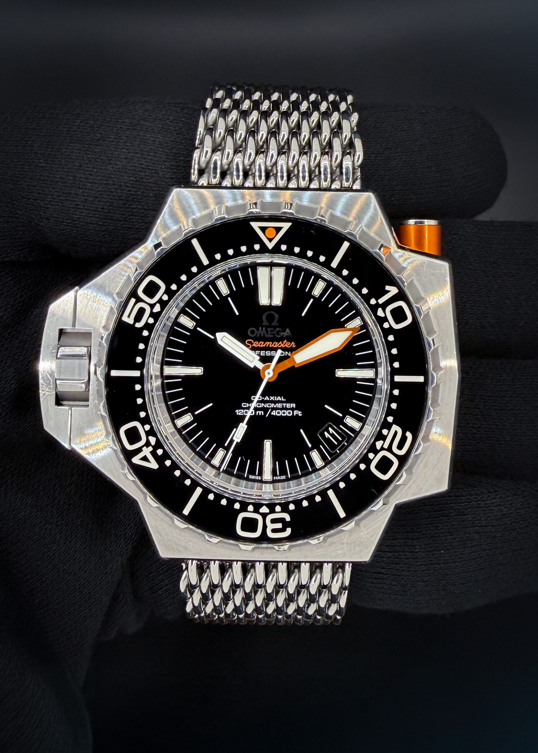 Omega Seamaster Professional PloProf 224.30.55.21.01.001 in a 55x48mm stainless steel case, powered by the Omega Co-Axial caliber 8500. This Omega has been tested in excellent working order and is ready for wear or to be added to a collection. Includes the original outer box, inner case, booklet, leatherette wallet, both hang-tags; Chronometer Certificate; Pictogram Card; and Warranty Card (dated 2009/11/16).  This PloProf is paired with the original "SharkProof" stainless steel bracelet with micro-adjusting folding buckle. The bracelet has six (6) removable links currently installed and will fit up to a 9-inch wrist. 