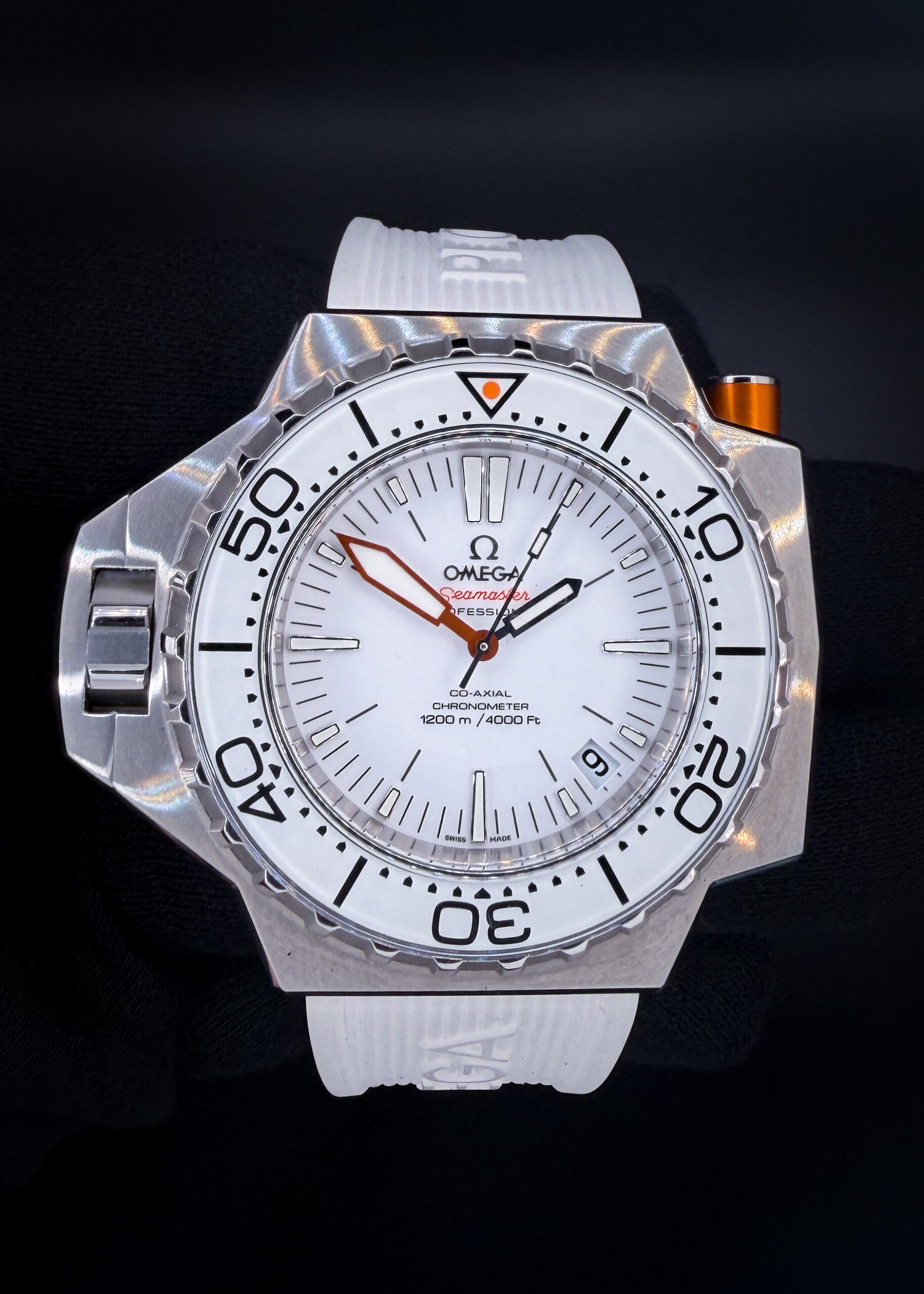 Omega Seamaster Professional PloProf 224.30.55.21.01.001 "Great White" in a 55x48mm stainless steel case, powered by the Omega Co-Axial caliber 8500. This Omega has been tested in excellent working order and is ready for wear or to be added to a collection. Includes a new Wrist Wraith Travel Case and the TLC Warranty & Authentication Card.  This PloProf is paired with the original, bright-white Omega PloProf strap. Both sides are sized to a two (2) and will currently fit up to a 9.5 inch wrist before sizing. 