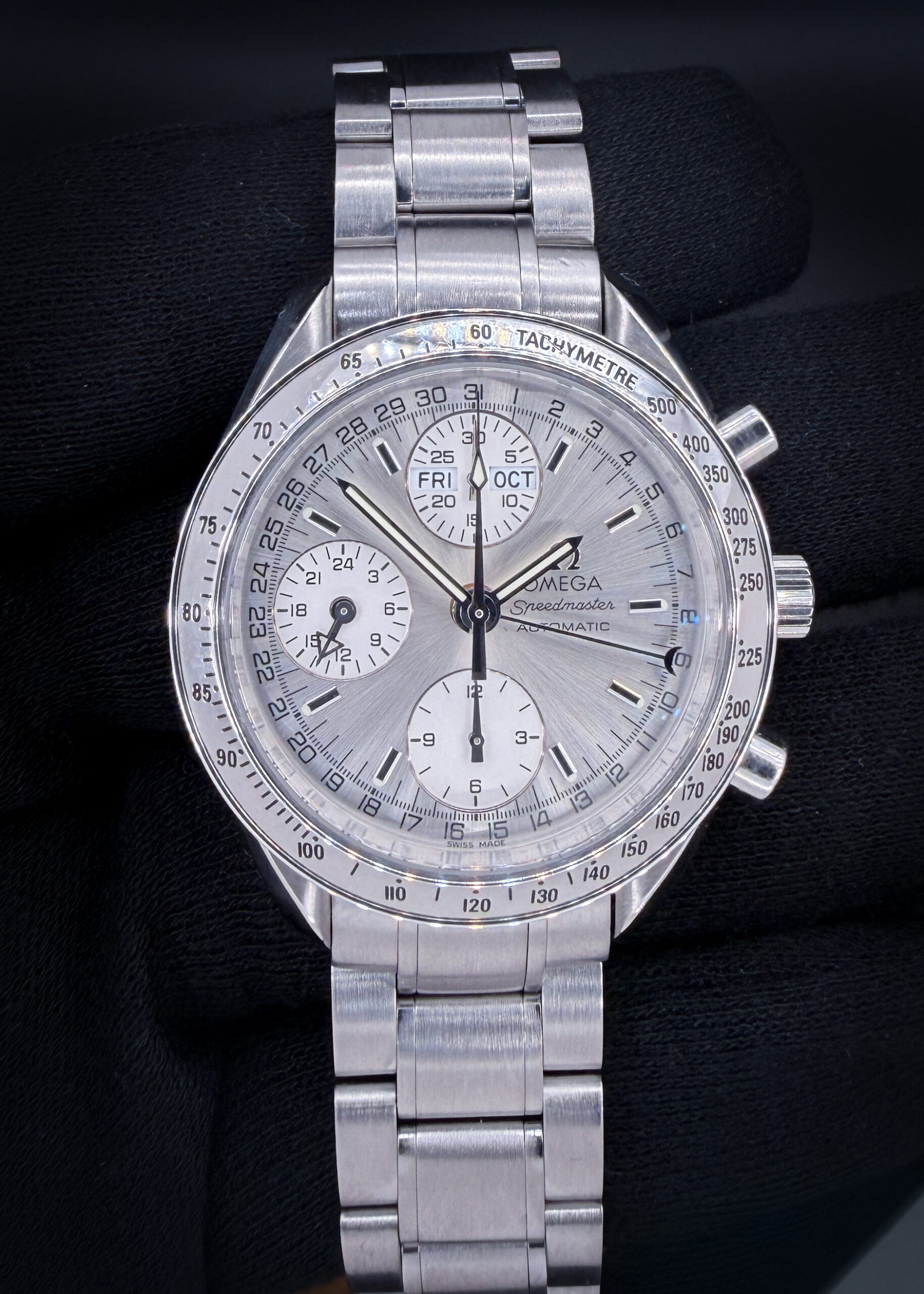 c. 2008 Omega Speedmaster Day-Date Triple Calendar 3523.30.00 in a 39mm stainless steel case, featuring the Omega caliber 1151 automatic movement. This Speedmaster has been tested in excellent working order and is ready for wear or to be added to a collection. It includes the outer box; inner red case; operating instructions, leather wallet; serial-number hang-tag; open warranty card; and pictogram card. Accuracy Testing: -2 SPD / 261 Amplitude / .1ms Beat Error Caseback Serial Number: 90199758