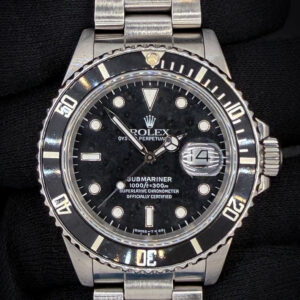 1988 Rolex Submariner Date 168000 "Triple-Zero" "Ghost Reference" in a 40mm stainless steel case, featuring the Rolex calibre 3035 automatic movement. This Rolex has been tested in excellent working order and is ready for wear or to be added to a collection. Includes a new Wrist Wraith watch roll and the TLC Authentication and Warranty Card. Case Serial Number: R594XXX