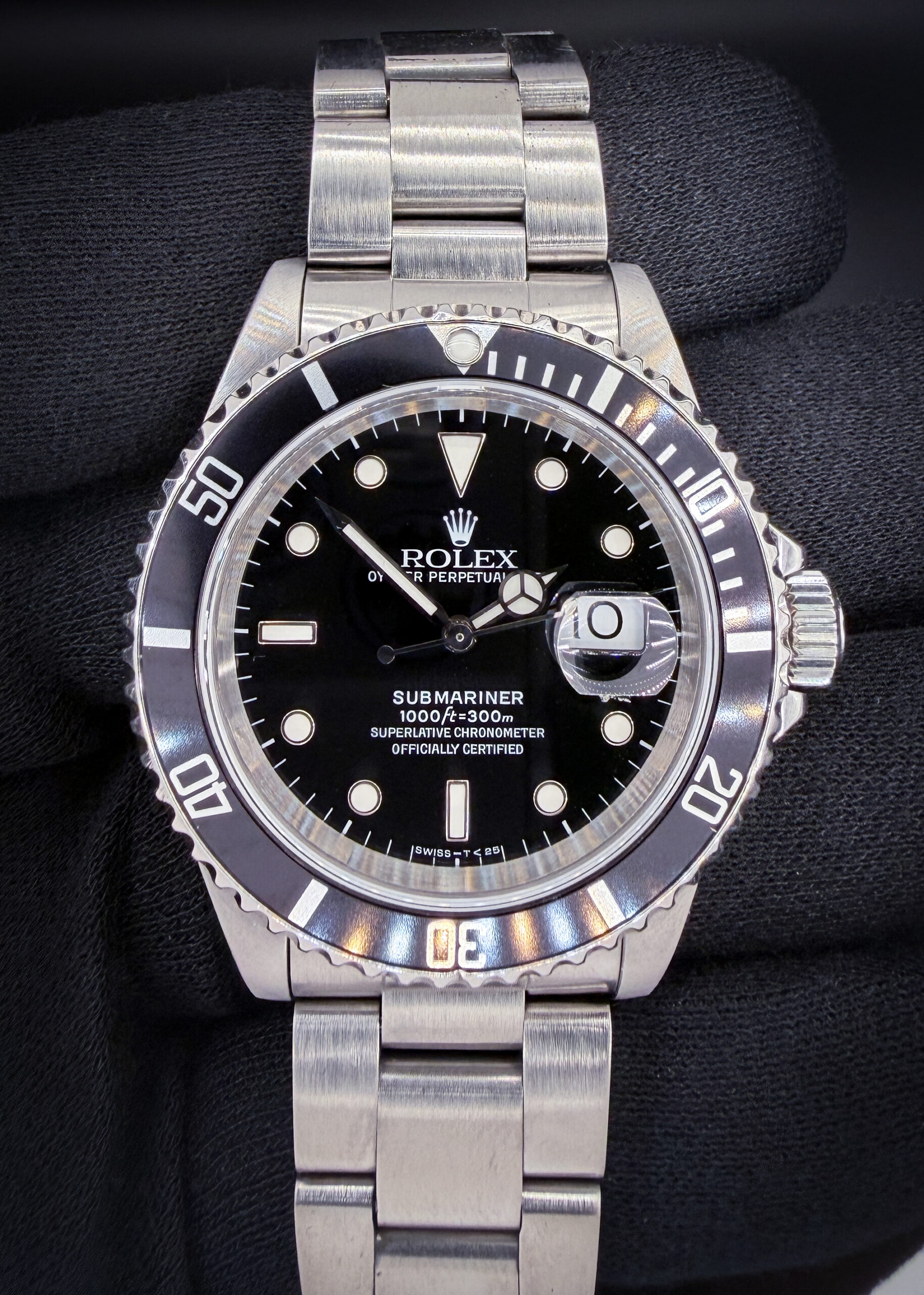 Vintage 1994Rolex Submariner Date reference 16610, presented in stainless steel with the classic black dial and matching black bezel that made this reference one of the most recognizable modern Rolex sports watches ever produced. The 40mm Oyster case delivers the clean, balanced proportions collectors appreciate in late 1990s Submariner models. Freshly serviced in October 2026, this example offers the strong mechanical performance and timeless tool-watch character that continue to make the 16610 a cornerstone reference for both new and seasoned Rolex collectors. Case Serial Number: S315601 Accuracy Testing: +/-0 SPD / 303 amplitude / 0.0ms beat error