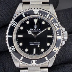 1999 (A-Serial) Rolex 14060 Submariner "No-Date" in a 40mm stainless steel case, powered by the Rolex caliber 3000 automatic movement. This Submariner has been tested in good working order and is ready for wear or to be added to a collection. Includes a new Wrist Wraith Travel Roll and the TLC Warranty & Authentication Card.  Case Serial Number: A728XXX Accuracy Testing: -7 SPD / 280 Amplitude / .2ms Beat Error